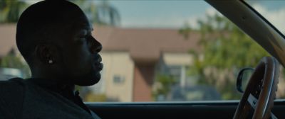 Still from Moonlight (2016) that has been tagged with: medium close-up & profile shot & day