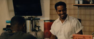 Still from Moonlight (2016) that has been tagged with: over-the-shoulder & interior & restaurant & medium wide & diner