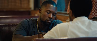 Still from Moonlight (2016) that has been tagged with: b38a6b & night & over-the-shoulder & medium shot