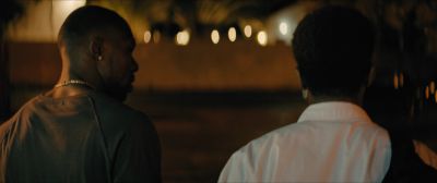 Still from Moonlight (2016) that has been tagged with: two-shot & exterior & medium shot & night