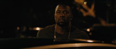 Still from Moonlight (2016) that has been tagged with: exterior & night & car & clean single