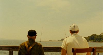 Still from Moonrise Kingdom (2012) that has been tagged with: over-the-shoulder & horizon & fishing