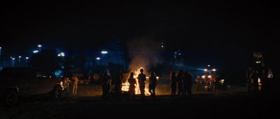Still from Mud (2013) that has been tagged with: fire & group-shot