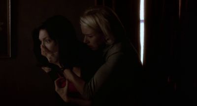 Still from Mulholland Drive (2001) that has been tagged with: medium shot & horrified & hiding & interior & day