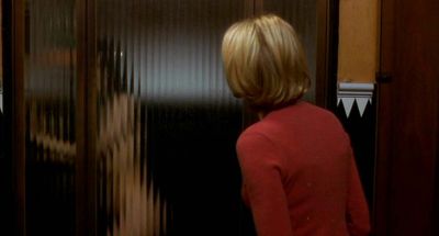 Still from Mulholland Drive (2001) that has been tagged with: 6e1c1c & night & interior & over-the-shoulder