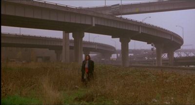 Still from My Own Private Idaho (1991) that has been tagged with: 6e1c1c & under highway & overpass & day & highway