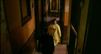 Still from My Own Private Idaho (1991) that has been tagged with: c5b359 & interior & high-angle