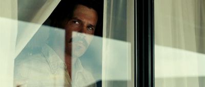 Still from No Country For Old Men (2007) that has been tagged with: reflection & window