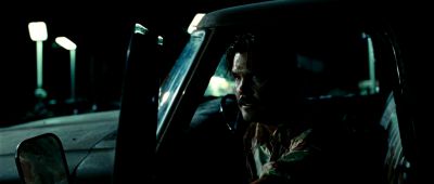 Still from No Country For Old Men (2007) that has been tagged with: car interior & exterior & medium close-up