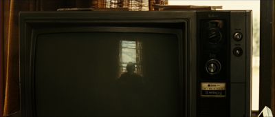 Still from No Country For Old Men (2007) that has been tagged with: reflection & interior & tv