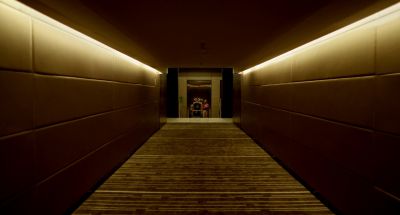 Still from Only God Forgives (2013) that has been tagged with: hallway & interior & fluorescent light & one-point-perspective & wide shot