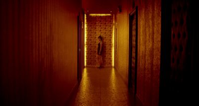 Still from Only God Forgives (2013) that has been tagged with: 6e1c1c & clean single & hallway & night & interior