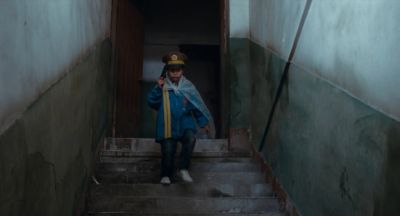 Still from Only the River Flows (2023) that has been tagged with: stairs & child & day & interior