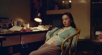 Still from Only the River Flows (2023) that has been tagged with: pregnant & practical lamp