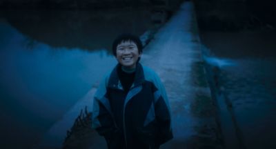 Still from Only the River Flows (2023) that has been tagged with: 034f96 & night