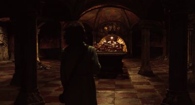 Still from Pan's Labyrinth (2006) that has been tagged with: 714f38 & medium wide & interior & night & over-the-shoulder