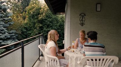 Still from Paradise: Love (2012) that has been tagged with: day & balcony & eating & exterior