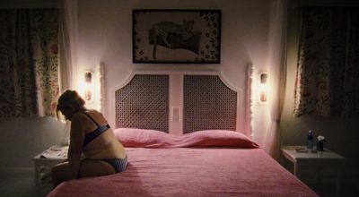 Still from Paradise: Love (2012) that has been tagged with: night & wide shot & practical lamp & bed