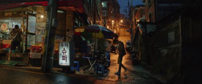 Still from Parasite (2019) that has been tagged with: wide shot & korea & street & night