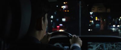 Still from Parasite (2019) that has been tagged with: driving & over-the-shoulder & night & car interior