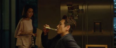 Still from Parasite (2019) that has been tagged with: two-shot & drinking & night & profile shot