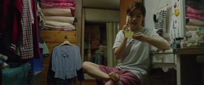 Still from Parasite (2019) that has been tagged with: closet & interior & night & bedroom