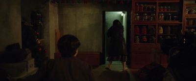 Still from Parasite (2019) that has been tagged with: interior & wide shot & doorway & night
