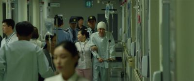 Still from Parasite (2019) that has been tagged with: hospital & hallway & interior & group-shot