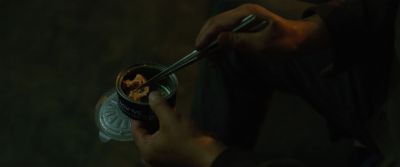 Still from Parasite (2019) that has been tagged with: can & chopsticks