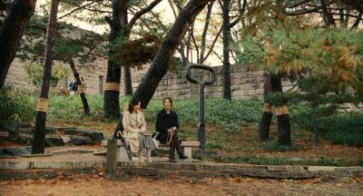 Still from Past Lives (2023) that has been tagged with: day & park & exterior & trees