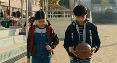 Still from Past Lives (2023) that has been tagged with: 0f0f0f & basketball