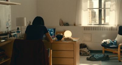 Still from Past Lives (2023) that has been tagged with: window & interior & desk & day