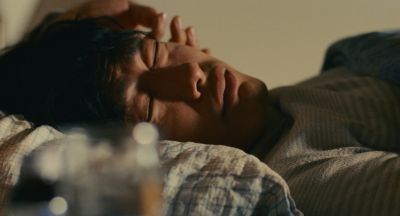 Still from Past Lives (2023) that has been tagged with: bedroom & interior & day & bed & close-up