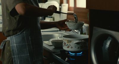 Still from Past Lives (2023) that has been tagged with: cooking & interior & stove