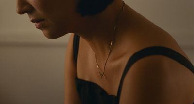 Still from Past Lives (2023) that has been tagged with: necklace & interior