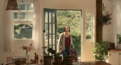 Still from Past Lives (2023) that has been tagged with: doorway & wide shot & day