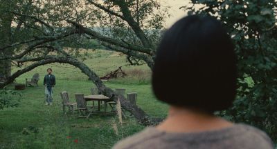 Still from Past Lives (2023) that has been tagged with: exterior & wide shot & two-shot & day