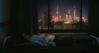 Still from Past Lives (2023) that has been tagged with: skyline & night & city