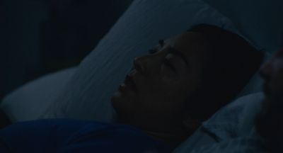 Still from Past Lives (2023) that has been tagged with: night & bedroom & bed & medium close-up