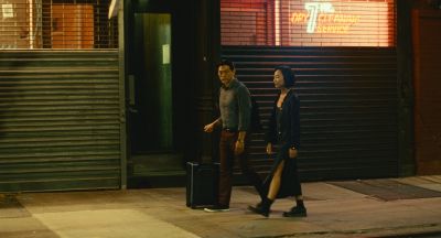 Still from Past Lives (2023) that has been tagged with: night & exterior & wide shot & neon