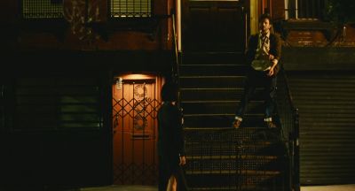 Still from Past Lives (2023) that has been tagged with: wide shot & exterior & stairs & night