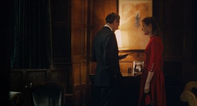 Still from Phantom Thread (2017) that has been tagged with: 6e1c1c & wide shot & night & two-shot & interior