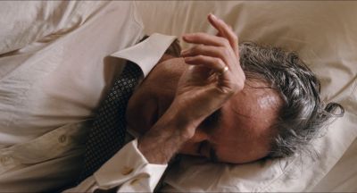 Still from Phantom Thread (2017) that has been tagged with: bedroom & medium close-up