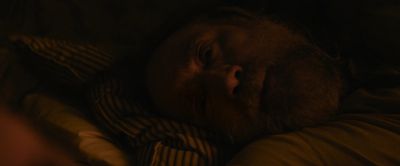Still from Pig (2021) that has been tagged with: laying down & bed