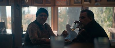 Still from Pig (2021) that has been tagged with: medium shot & beer & profile shot & interior & day