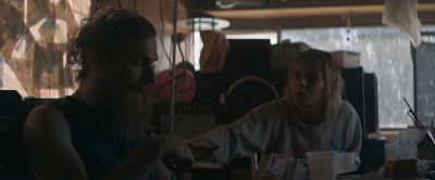 Still from Pig (2021) that has been tagged with: junkies & table
