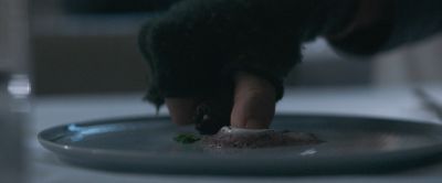 Still from Pig (2021) that has been tagged with: 4f404c & day & plate & hand & insert