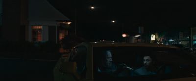 Still from Pig (2021) that has been tagged with: car & night & medium wide