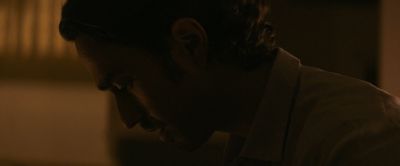 Still from Pig (2021) that has been tagged with: profile shot & interior & clean single & close-up