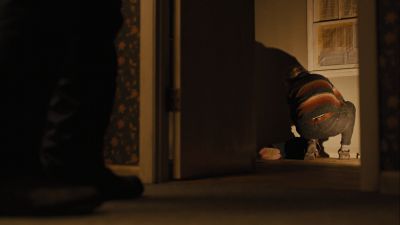 Still from Prisoners (2013) that has been tagged with: a67a59 & doorway & over-the-shoulder & night